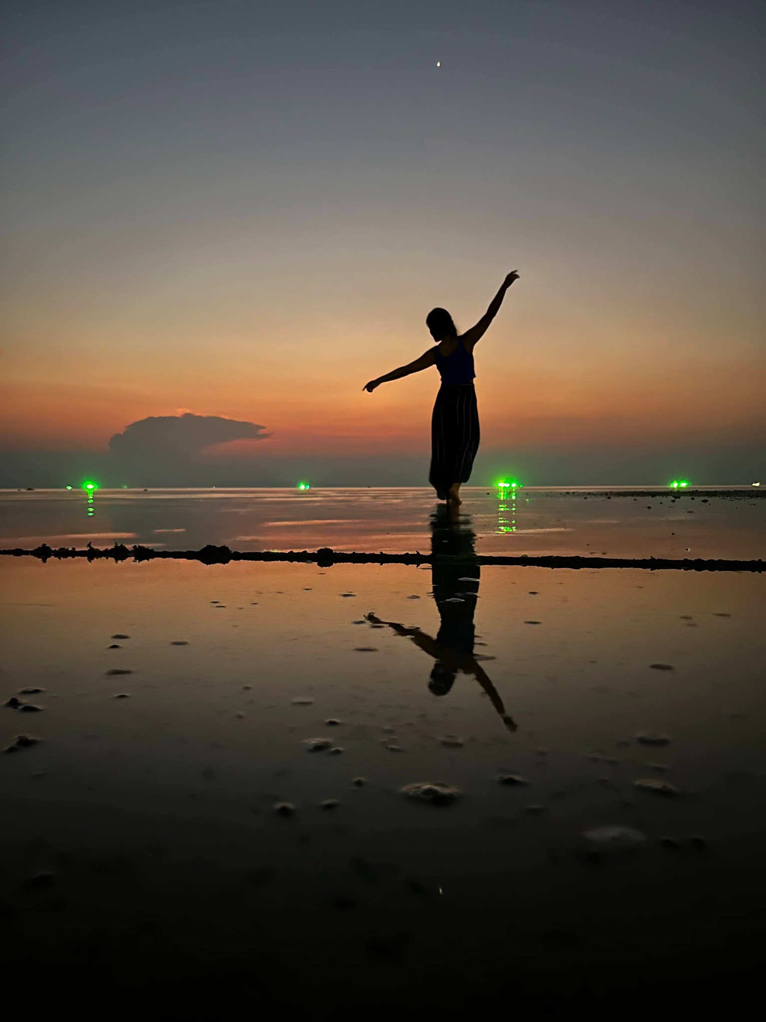 Silhouette dancing at sunset in Thailand